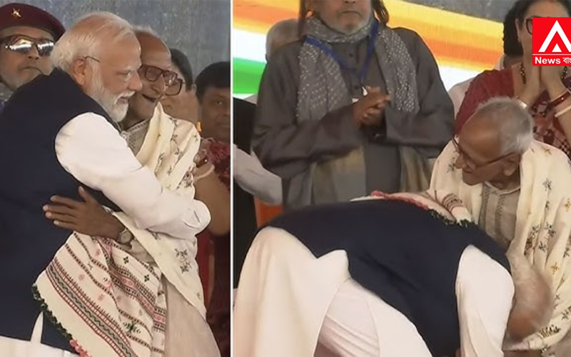 On a packed stage, the country's Prime Minister bowed down to touch the feet of this 97-year-old man.